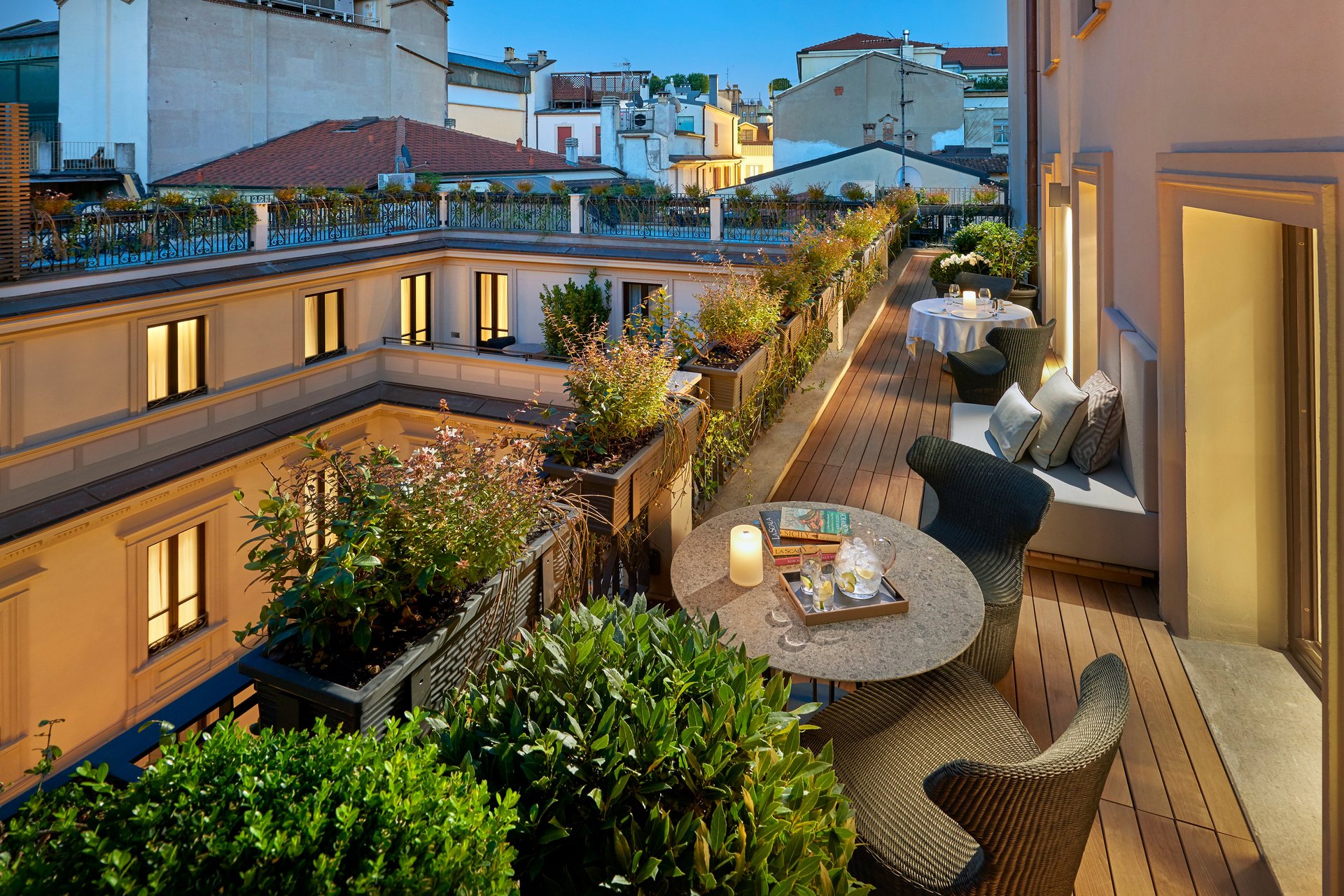 A planted suite terrace at Mandarin Oriental, Milan, looking over the Milan rooftops
